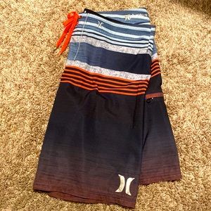 Hurley Navy/Slate Blue/Coral swim trunks. Size 36. Excellent condition.